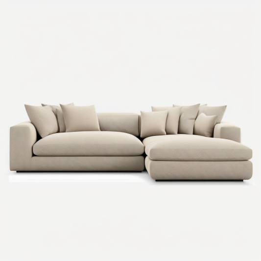 A contemporary sectional sofa in a soft beige fabric