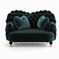 Overstuffed loveseat with a soft velvet upholstery and plush cushioning.